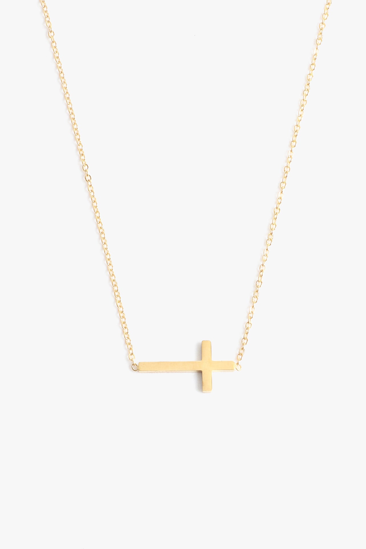 Marrin Costello Jewelry Barry Necklace sideways cross necklace with lobster clasp closure and extender. Waterproof, sustainable, hypoallergenic. 14k gold plated stainless steel.