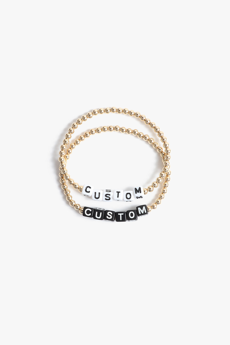 Marin Costello Jewelry Crown Letter Bracelet beaded block letter bracelet, customizable. Black or white block letters, gold or silver beads. Waterproof, sustainable, hypoallergenic. 14k gold plated stainless steel.