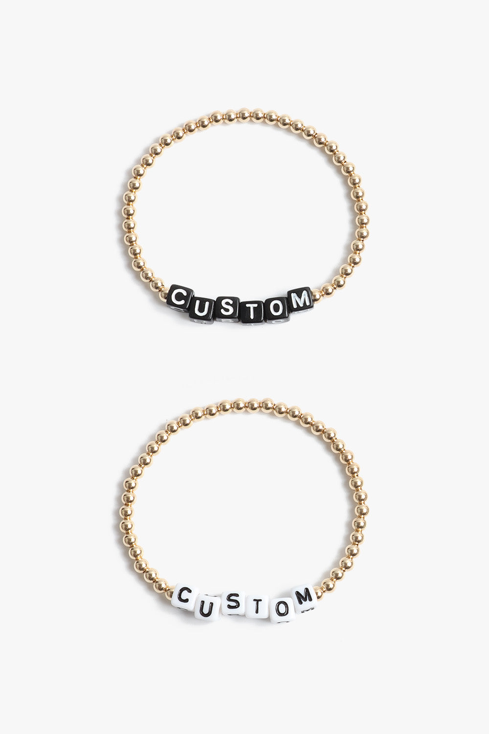 Marin Costello Jewelry Crown Letter Bracelet beaded block letter bracelet, customizable. Black or white block letters, gold or silver beads. Waterproof, sustainable, hypoallergenic.14k gold plated stainless steel.