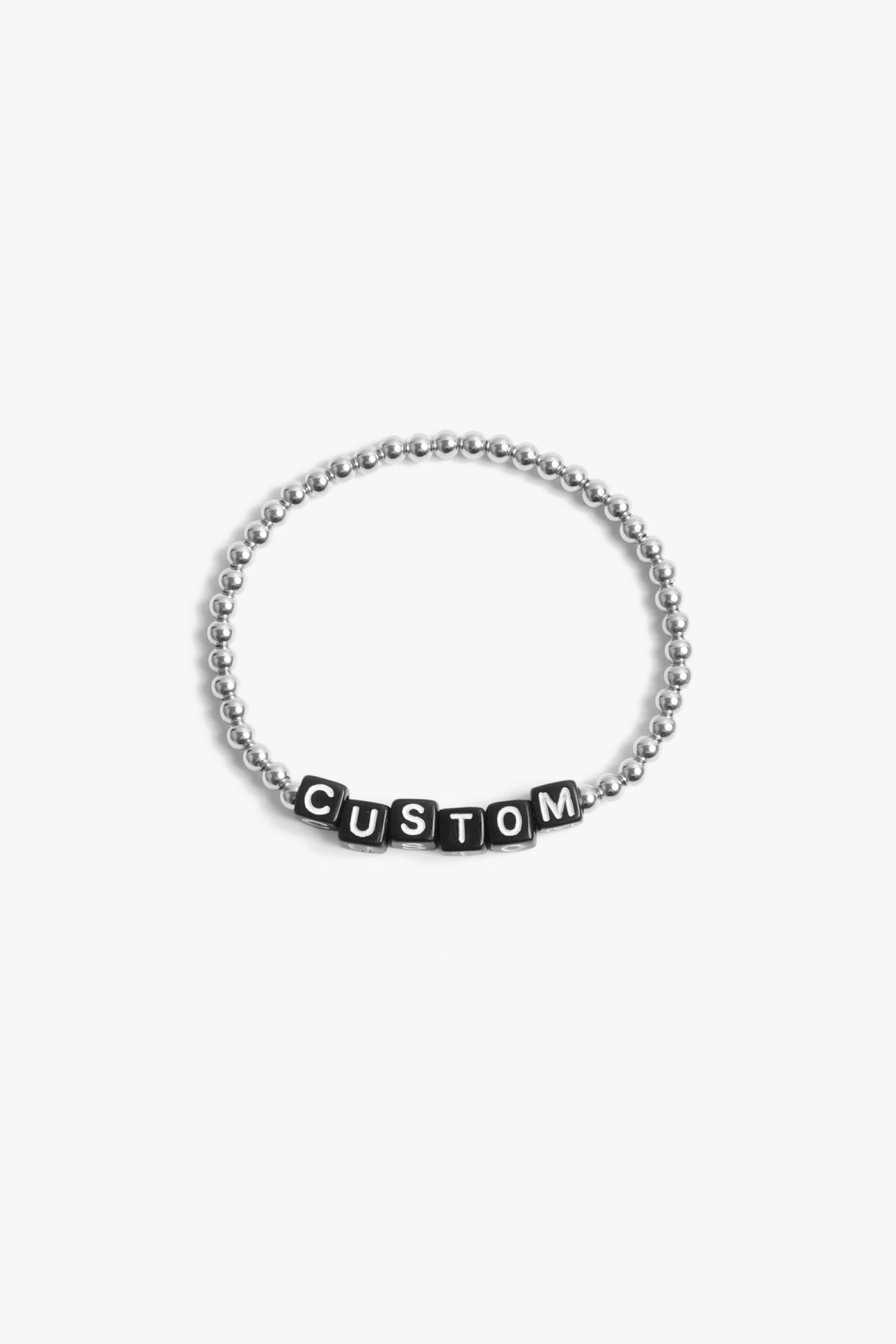 Marin Costello Jewelry Crown Letter Bracelet beaded block letter bracelet, customizable. Black block letters, silver beads. Waterproof, sustainable, hypoallergenic. Polished stainless steel.