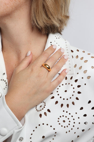 Marrin Costello wearing Marrin Costello Jewelry Layla Ring simple dome crescent ring. Available in sizes 6, 7, 8. Waterproof, sustainable, hypoallergenic. 14k gold plated stainless steel.