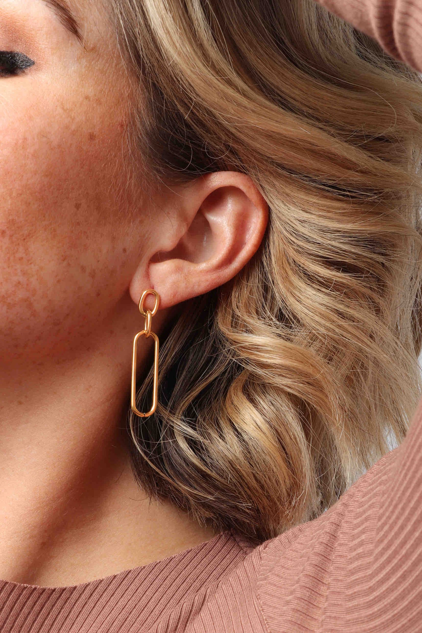 Marrin Costello wearing Marrin Costello Jewelry Mariposa Drops paperclip and Anita Chain post back earrings — for pierced ears. Waterproof, sustainable, hypoallergenic. 14k gold plated stainless steel.