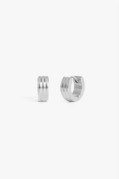 Marrin Costello Jewelry Evelyn 3mm Huggies ribbed small hoops with click tension hinge closure— for pierced ears. Waterproof, sustainable, hypoallergenic. Polished stainless steel.