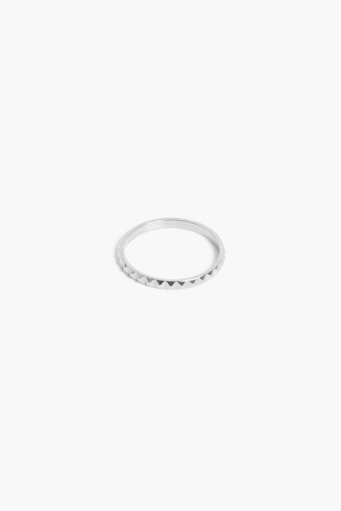 Marrin Costello Jewelry Melrose Band studded edgy stacking ring. Available in sizes 6, 7, 8. Waterproof, sustainable, hypoallergenic. Polished stainless steel.