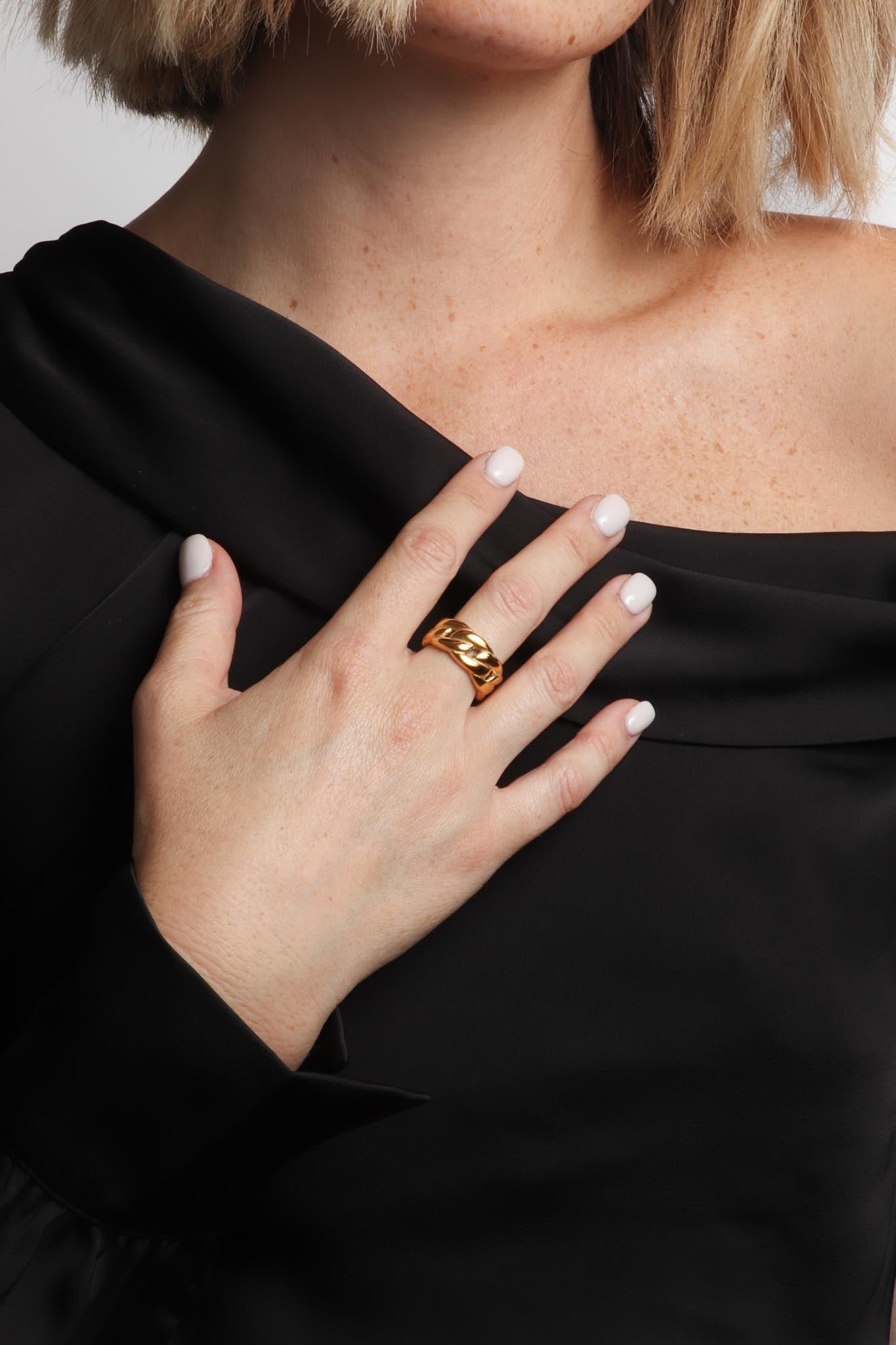 Marrin Costello wearing Marrin Costello Jewelry Queens Band cuban link statement ring. Available in sizes 6, 7, 8. Waterproof, sustainable, hypoallergenic. 14k gold plated stainless steel.